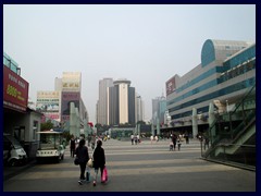 First sight of China: Luohu district  with Luohu Station, shopping mall, Shangri-La hotel and Shenzhen's skyline in afar. Luohu was the first district in the new city of Shenzhen in 1979. It is the Easternmost district of central Shenzhen, and is filled with tall skyscrapers, hotels and large shopping malls. Shennan Boulevard is running right through Luohu. Luohu is the first place many see of China when arriving in Shenzhen from Hong Kong, since the Immigration building is situated there, as well as Shezhen's Main Railway Station, a huge and very train station. Luohu Commercial City, a 5-storey shopping mall near the border control, is the only place many foreign Shenzhen visitors will visit, unfortunately, since there are som much else to see and do in Shenzhen! Dongmen shopping area with pedestrian steets, stores, restaurants, malls and a vibrant nightlife is also situated in the Luohu district. Unfortunately I wasn't able to find it. Our hotel, the 5-star Panglin Hotel, isi situated in the area. 